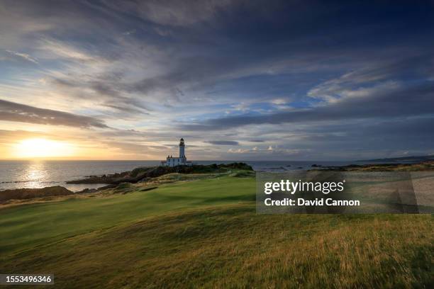 View of the green on the par 3, ninth hole beside The Turnberry Lighthouse as sunset on the Ailsa golf course at Trump Turnberry resort on July 09,...