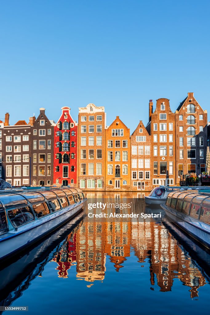 'Dancing Houses' along Damrak canal in Amsterdam, Holland, Netherlands