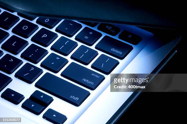 illuminated laptop - closing laptop stock pictures, royalty-free photos & images