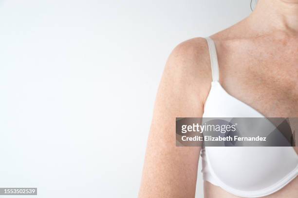 woman in white bra,  care and beauty concept. - シリコーン ストックフォトと画像