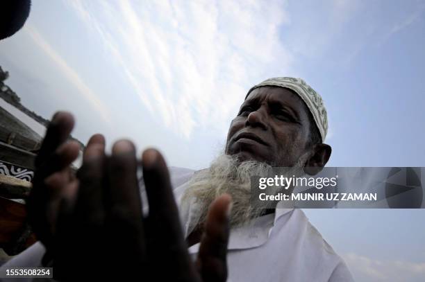 Mowali - a honey collector - offers special prayers in Khulna, some 350 kms southwest of Dhaka, on March 31 before entering the Sundarbans to collect...