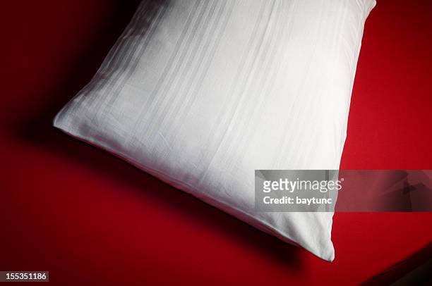 white pillow empty red bed - pillow case stock pictures, royalty-free photos & images