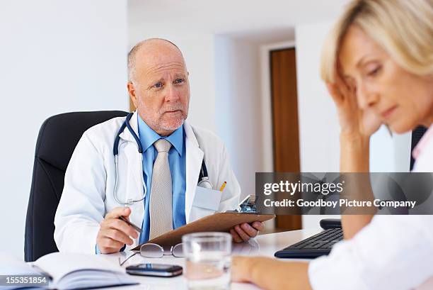 "we're here for you in this tough time" - patient bad news stock pictures, royalty-free photos & images