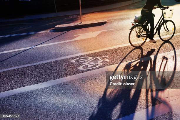 bicyclist crossing bike lane - vägmarkering bildbanksfoton och bilder