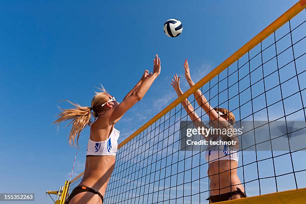 beach volley action on the net - volley stock-fotos und bilder