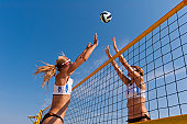 Beach volley action on the net