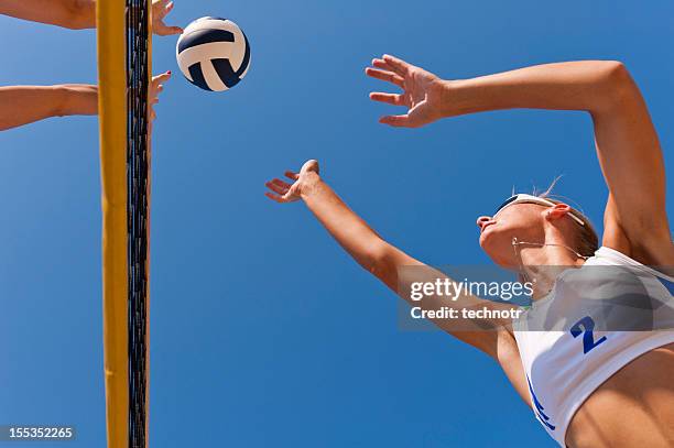 beach volley action on the net - beach volley stockfoto's en -beelden