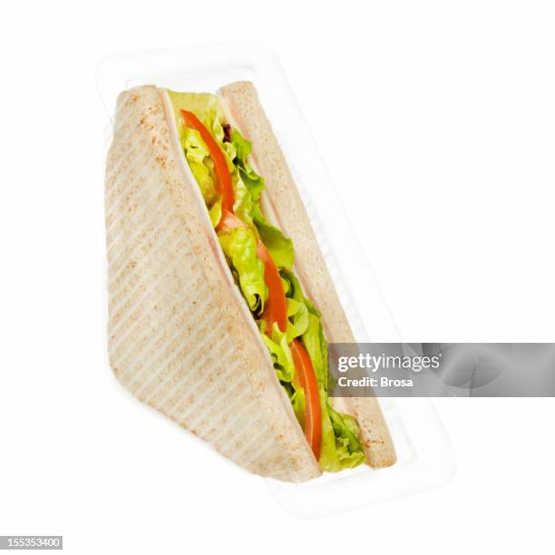 ham and cheese sandwich in plastic package - making a sandwich stockfoto's en -beelden