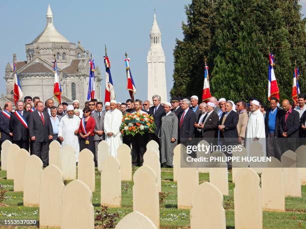 People spend moments in silence at the military cemetary of Notre-Dame-de-Lorette, in Ablain-Saint-Nazaire near Arras, Northern France, 20 April...