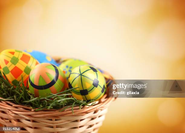 easter eggs in a basket. - empty easter basket stock pictures, royalty-free photos & images