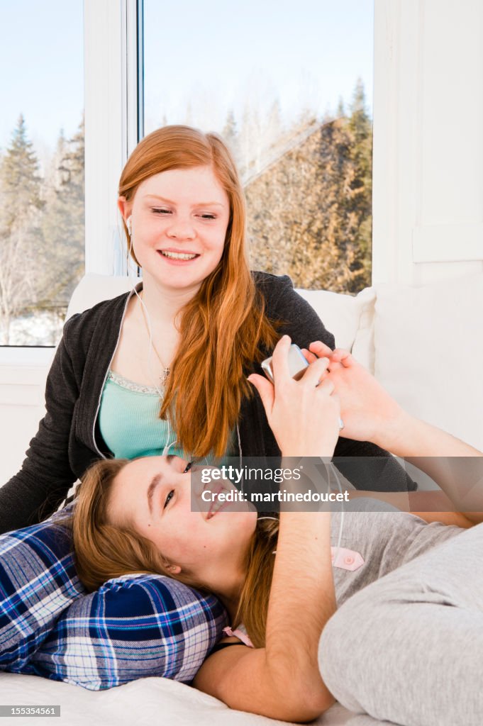 Teenagers chilling listening to music.