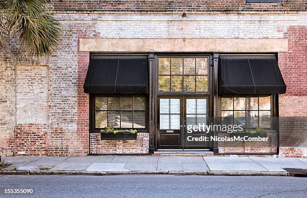 colonial storefront with awnings - front view stock pictures, royalty-free photos & images