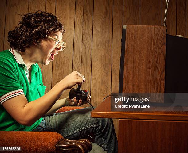 gamer nerd playing video games on t.v. - man cave stock pictures, royalty-free photos & images