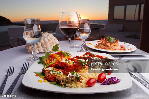 prawn dinner at sunset - lobster dinner stock pictures, royalty-free photos & images