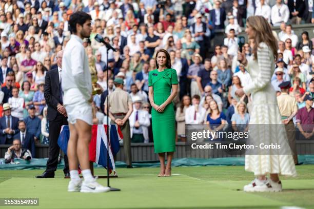 Carlos Alcaraz of Spain with the winners trophy gives his on-court interview with Annabel Croft after his victory watched by by Catherine, Princess...