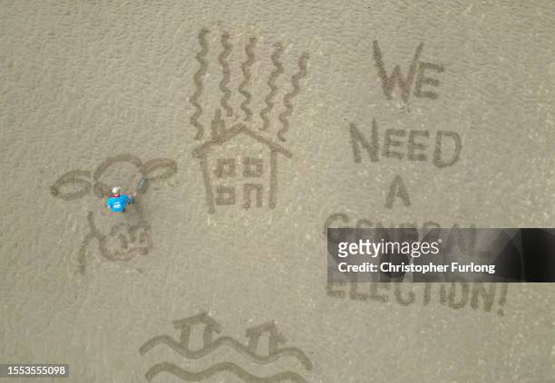 Giant sand drawing entitled 'Postcards from the Edge' sends a message to UK Prime Minster Rishi Sunak asking to help protect Skegness and the UK from...