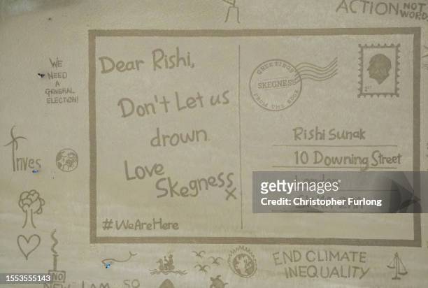 Giant sand drawing entitled 'Postcards from the Edge' sends a message to UK Prime Minster Rishi Sunak asking to help protect Skegness from from...