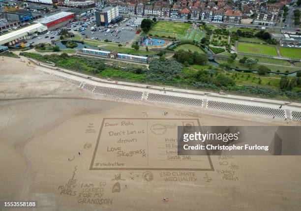 Giant sand drawing entitled 'Postcards from the Edge' sends a message to UK Prime Minster Rishi Sunak asking to help protect Skegness and the UK from...