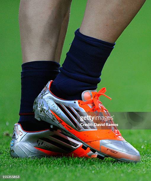 Lionel Messi of FC Barcelona warms up wearing his personalised new boots with the name of his newborn son Thiago prior to the star of the La Liga...