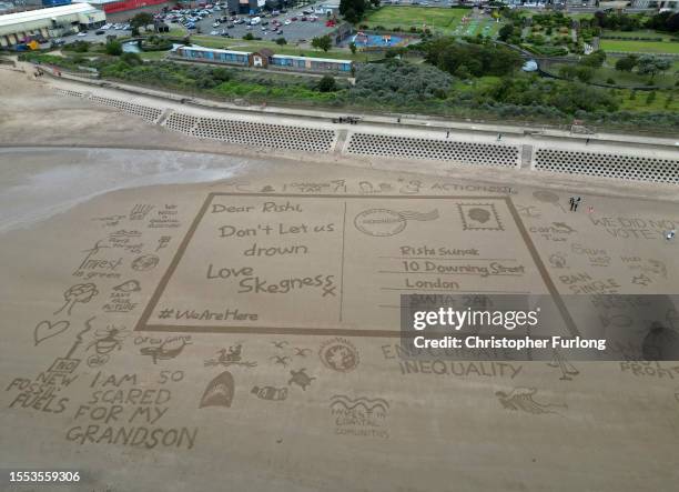 Giant sand drawing entitled 'Postcards from the Edge' sends a message to UK Prime Minster Rishi Sunak asking to help protect Skegness and the UK from...