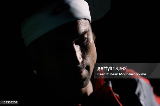 David Ferrer of Spain walks on court to play against Michael Llodra of France in their Semi Final match on day 6 of the BNP Paribas Masters at Palais...