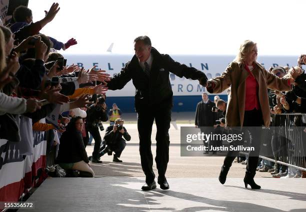 Republican presidential candidate, former Massachusetts Gov. Mitt Romney and his wife Ann Romney greet supporters during a campaign rally at Dubuque...