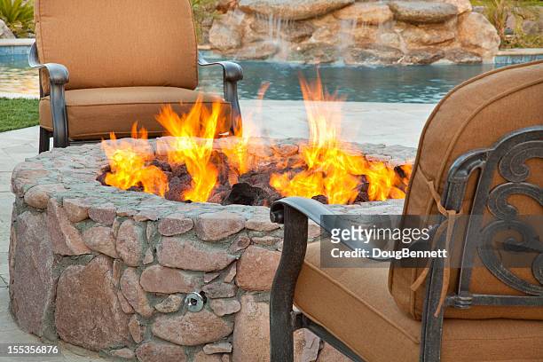poolside fireside seating - fire pit stock pictures, royalty-free photos & images