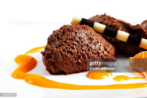 chocolate mousse with orange sauce - chocolate mousse stock pictures, royalty-free photos & images