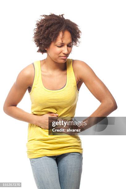 woman suffering from a stomach ache - buikpijn stockfoto's en -beelden