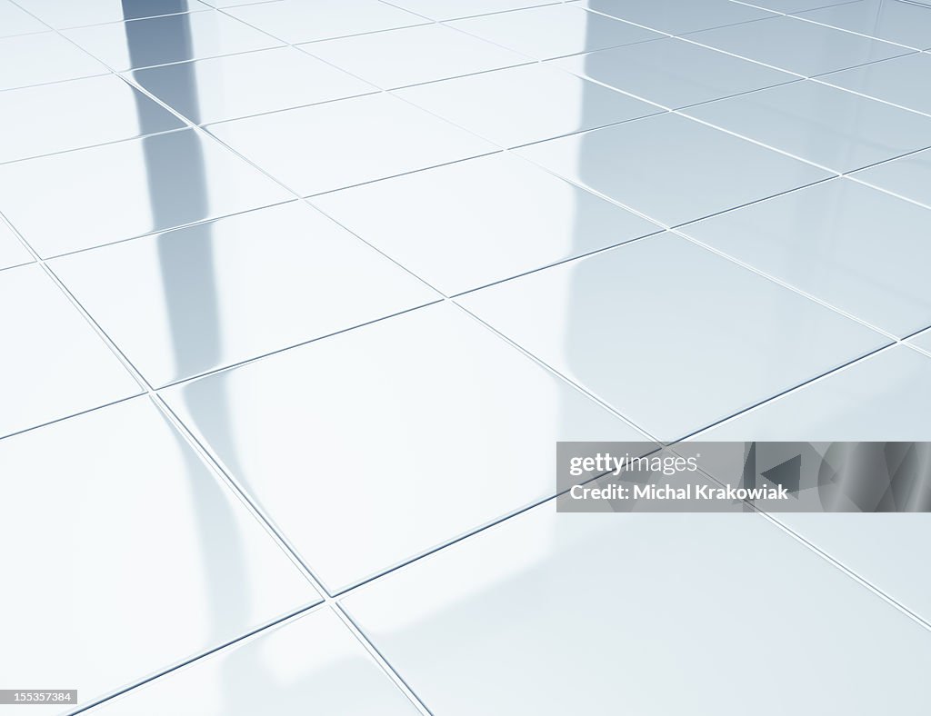 White tiles on a floor in bathroom