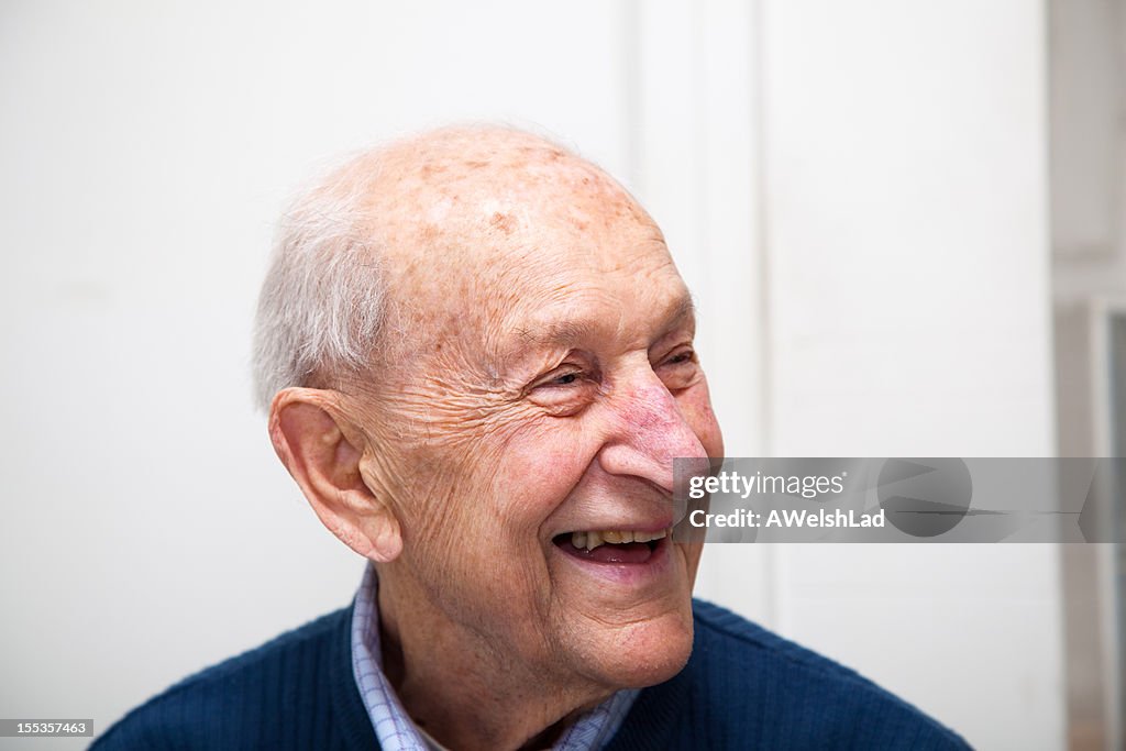 Senior adult male portrait laughing