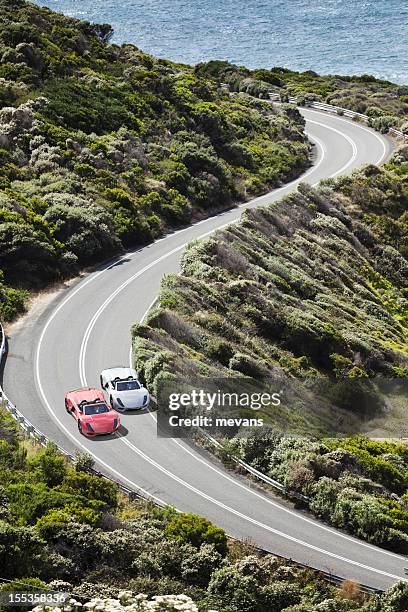 racing on a coastal road - street racing stock pictures, royalty-free photos & images