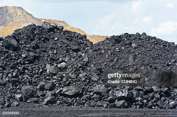 coal heap at loading pad on mine site - coal mine stock pictures, royalty-free photos & images