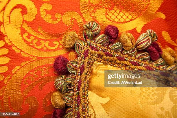 luxurious red and gold pillows with beautiful tasselss - brocade stock pictures, royalty-free photos & images