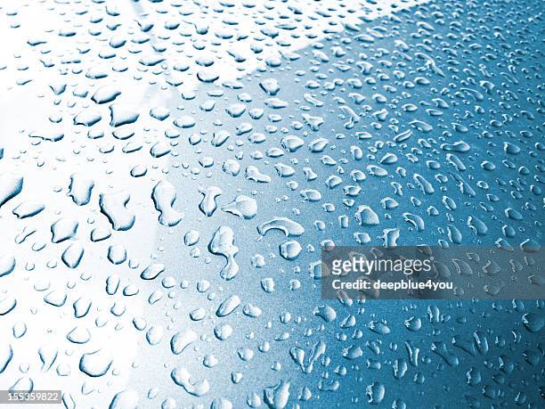water drops on a blue metallic car hood - steamed stock pictures, royalty-free photos & images