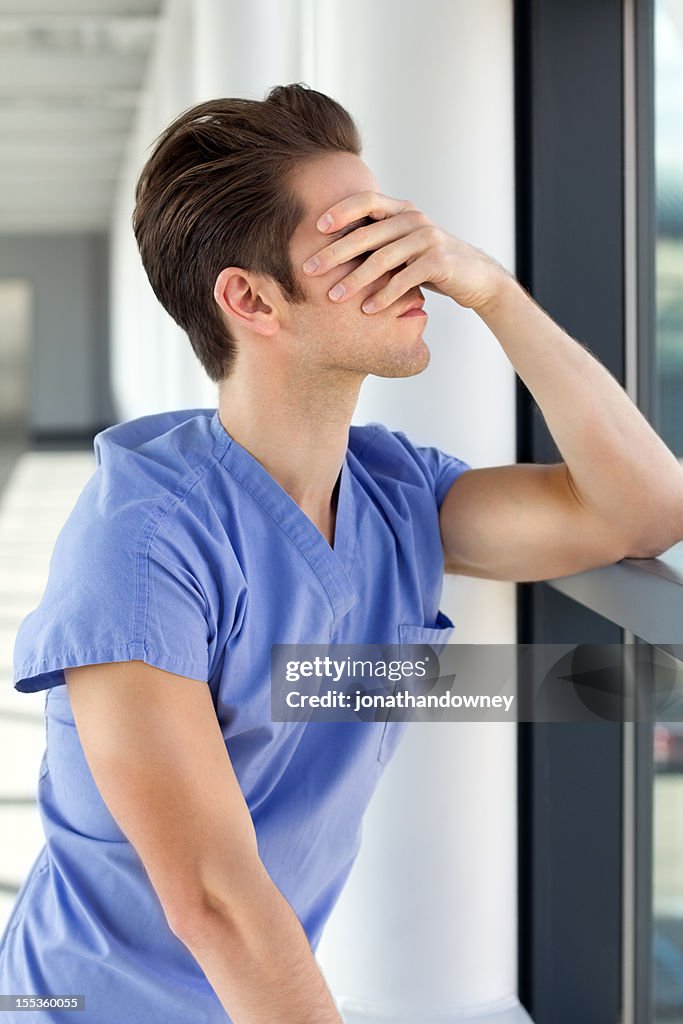 Young Man in Blue Scrubs