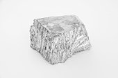 Small nugget of Zinc on a white background