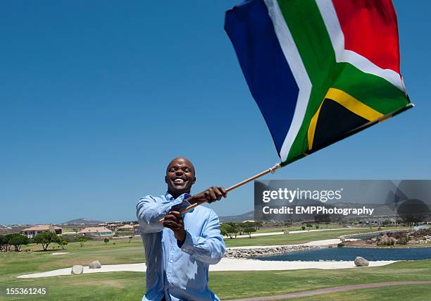 man waving south african flag - south africa flag stock pictures, royalty-free photos & images