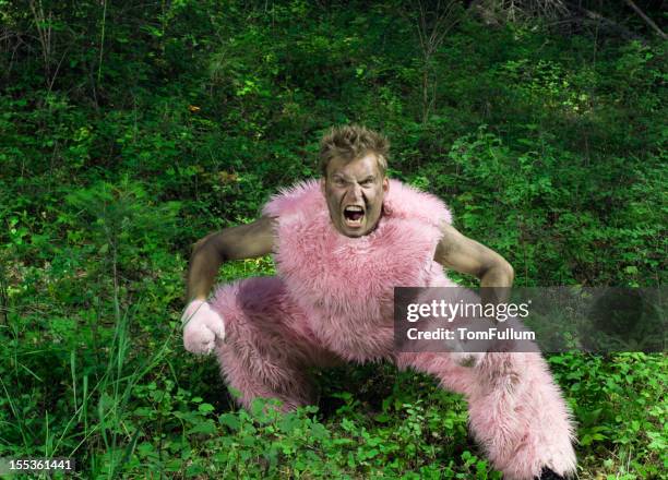 pink furry man - fur stock pictures, royalty-free photos & images