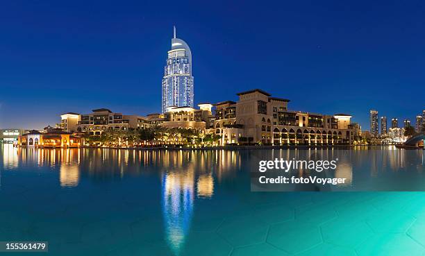 dubai luxury lakeside hotels and apartments illuminated uae - dubai mall stock pictures, royalty-free photos & images