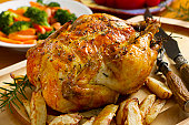 Roast chicken dinner, topped with thyme