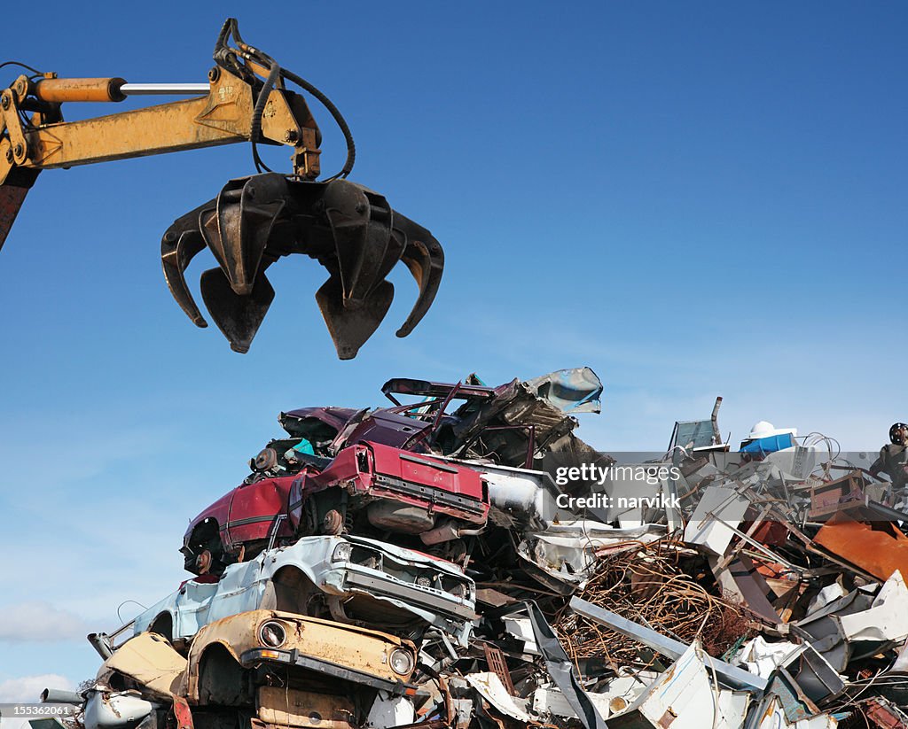 Crane loader taking scrap iron