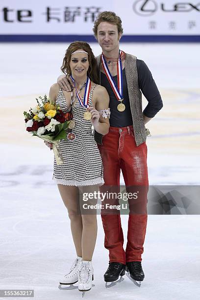 Ice dancing gold medalists Nathalie Pechalat and Fabian Bourzat of France pose for photo during the medal ceremony of Cup of China ISU Grand Prix of...