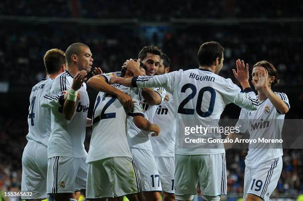 Angel Di Maria of Real Madrid CF celebrates scoring their second goal with teammates Sergio Ramos , Pepe , Alvaro Arbeloa , Gonzalo Higuain and Luka...