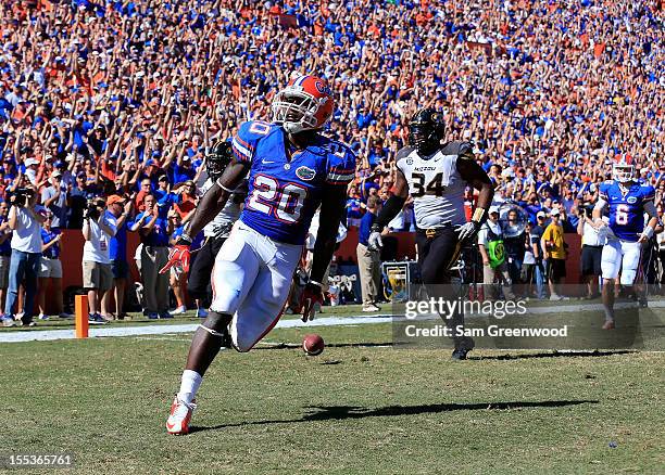 Omarius Hines of the Florida Gators crosses the goal line for a touchdown during the game against the Missouri Tigers at Ben Hill Griffin Stadium on...