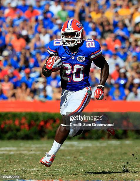 Omarius Hines of the Florida Gators runs for yardage during the game against the Missouri Tigers at Ben Hill Griffin Stadium on November 3, 2012 in...