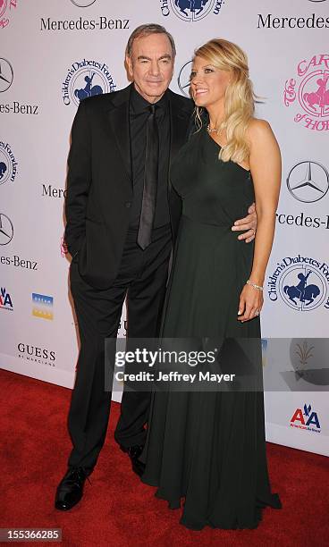 Neil Diamond and Katie McNeil arrive at the 26th Anniversary Carousel Of Hope Ball presented by Mercedes-Benz at The Beverly Hilton Hotel on October...