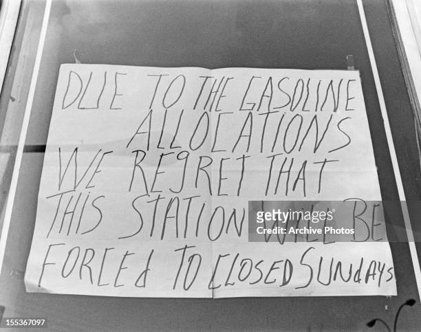Sign at a petrol station announcing Sunday closures, USA, circa 1974. The sign reads: 'Due to the gasoline allocations we regret that this station...