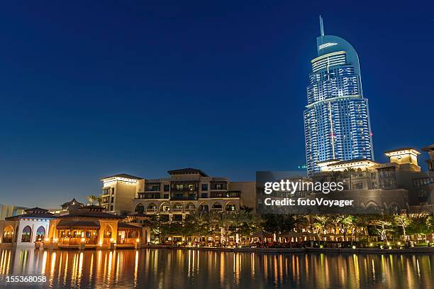 dubai high rise hotel luxury apartments waterside restaurants at dusk - dubai mall stock pictures, royalty-free photos & images