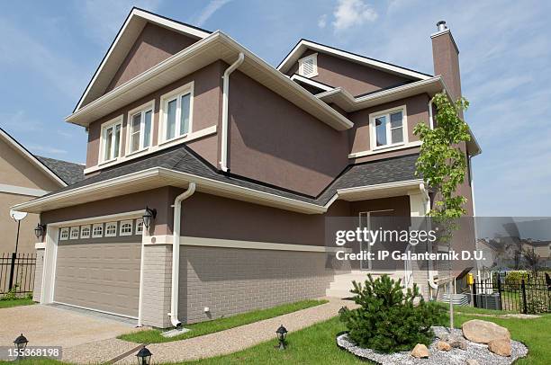 brand new suburban house in sunny summer afternoon - borough district type stock pictures, royalty-free photos & images